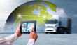 © sittinan - concept  of Man hand holding tablet or cell phone  with Augmented reality screen software and blue tone of automate wireless control Truck run on road, Drive on road, transportation logistic concept