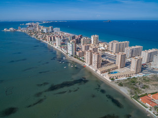 Aerial photo of tall buildings and the beach on a natural spit of La Manga between the Mediterranean and the Mar Menor, Cartagena, Costa Blanca, Spain 2