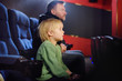© Maria Sbytova - Cute little boy with his father watching cartoon movie in the cinema