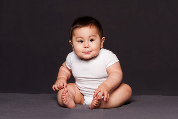 cute happy baby sitting