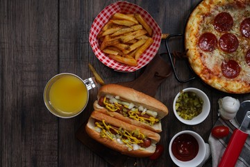 Party game day food Homemade Pizza hot dogs fries and dips ,top view