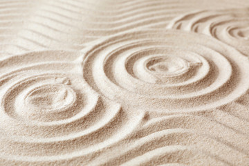 Zen garden pattern on sand. Meditation and harmony