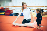 Coach talking with a young gymnast