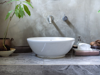 Clean loft style bathroom interior with modern sink basin faucet