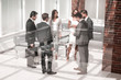 © ASDF - group of business people standing in the Bank hall