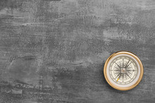 Golden Navigational Compass On A Vintage Gray Background