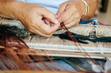 Woman Hands Weaving Thai Silk Fabric