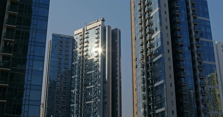 Wall Mural - Timelapse with glass of building with sunlight flare