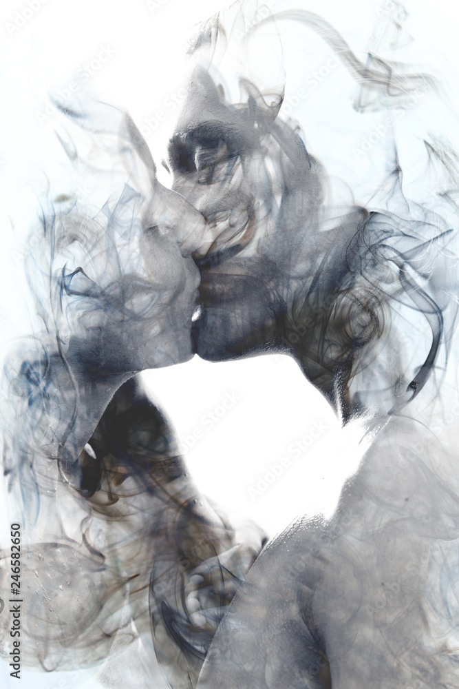 Double exposure of two blissful people close up embracing and becoming one with the smoky texture - obrazy, fototapety, plakaty 
