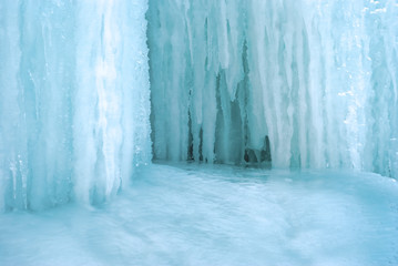 Wall Mural - background - a section of glacier with icicles