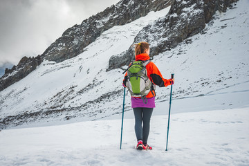 Wall Mural - young woman hiking in the mountains