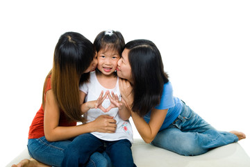 Poster - Asian family kissing little girl