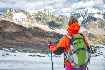 Wall Mural - young woman hiking in the mountains