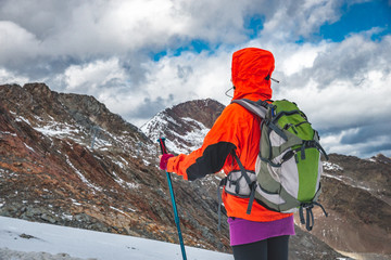 Wall Mural - young woman hiking in the mountains