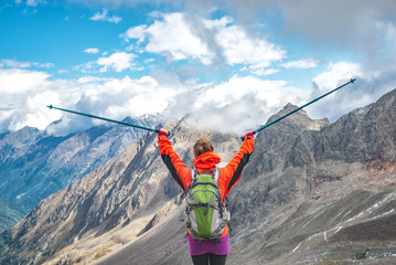 Wall Mural - young woman on the top of mountains