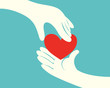 Hand giving a red heart to another hand