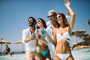 Group of friends having fun on summer vacation. Lifestyle, friendship, travel and holidays concept