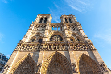 facade of notre dame de Paris, medieval cathedral (church) in paris, france