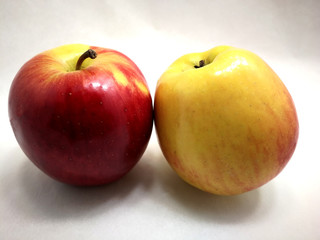 two colored apples on white