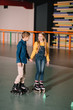 © LIGHTFIELD STUDIOS - Beautiful smiling skating and holding hands