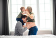 © Louis-Paul Photo - A father, son and pregnant mother at home. Beautiful loving family portrait
