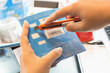 © Stock.Foto.Touch - Employees are putting nano SIM cards in the store for customers to buy. In the workplace really