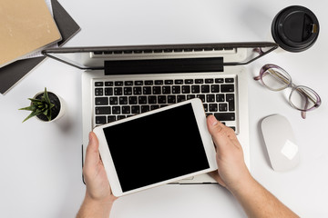 Man working with tablet, top view