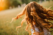 © yuriy - girl runs hair curls develop glow sun