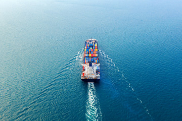 Wall Mural - Aerial view of container cargo ship in sea.