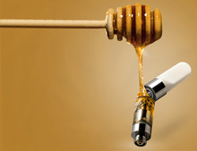 Honey Dripping Into Cartridge