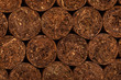 Cuban cigar texture. close-up detail of cigars. background on the topic of cigars