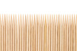 Bamboo toothpicks are placed in parallel - backgrounds, textures. Bamboo toothpicks isolated on white background