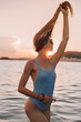 © pha88 - Girl with a gorgeous figure on the sea during sunset.Sexy girl on a wild beach.The girl in the water