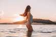 © pha88 - Girl with a gorgeous figure on the sea during sunset.Sexy girl on a wild beach.The girl in the water