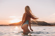 © pha88 - Girl with a gorgeous figure on the sea during sunset.Sexy girl on a wild beach.The girl in the water