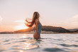 © pha88 - Girl with a gorgeous figure on the sea during sunset.Sexy girl on a wild beach.The girl in the water