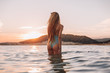 © pha88 - Girl with a gorgeous figure on the sea during sunset.Sexy girl on a wild beach.The girl in the water