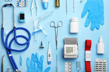 Wall Mural - Flat lay composition with medical objects on color background