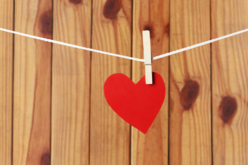 Wall Mural - Red paper hearts hanging on the rope in valentine day concept.