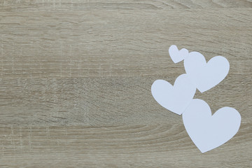 Wall Mural - White Heart paper on the wooden floor and have copy space.