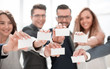 © ASDF - group of young professionals showing their business cards