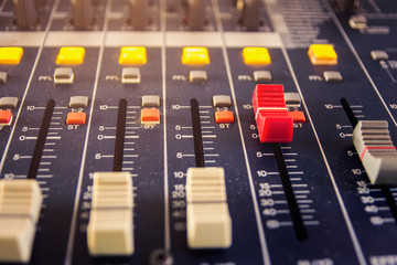 Slide the button to adjust the volume mixer of audio professionals. In the studio recording.