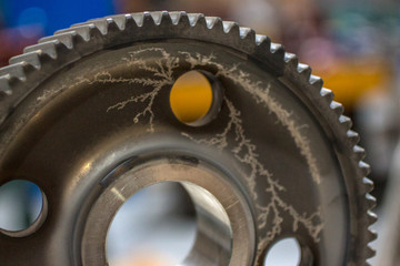 A beautiful effect on the gears in the process of nitriding to obtain a solid surface layer of metal.