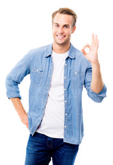 Wall Mural - Cheerful young man showing okay sign