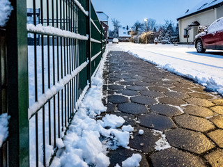 Concept of cobblestone pavement cleared from the snow