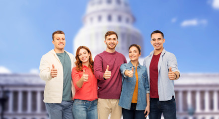 Sticker - friendship and people concept - group of smiling friends showing thumbs up over capitol building background