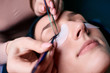 © Светлана Наклейщиков - Eyelash extension procedure close up. Beautiful Woman with long lashes in a beauty salon.