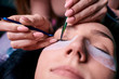 © Светлана Наклейщиков - Eyelash extension procedure close up. Beautiful Woman with long lashes in a beauty salon.