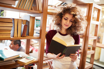 Female read book in library