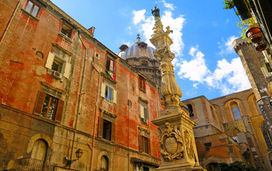 Wall Mural - Napoli, Piazza Riario Sforza square, Obelisk of  San Gennaro column and old buildings and dome in background. Naples Italy                     